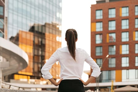rear-view-of-businesswoman-looking-business-buildi-2022-01-18-23-32-19-utc (1)